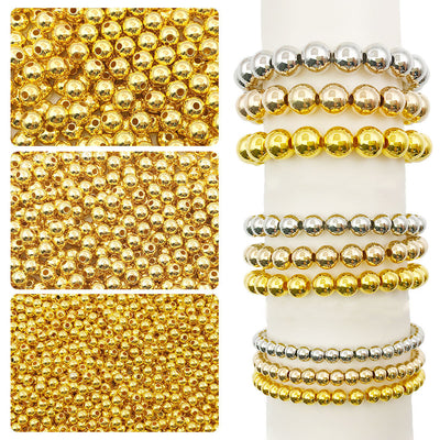 Yellow crimp bead jewelry findings arranged on a light background