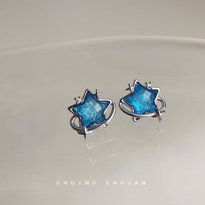 Blue star planet orbit studs on pale ceramic dish