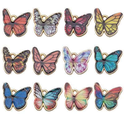 Colorful butterfly charms arranged on a light background