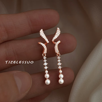 Rose Gold Tone Clear Stone Curved Ribbon And Pearl Long Earrings