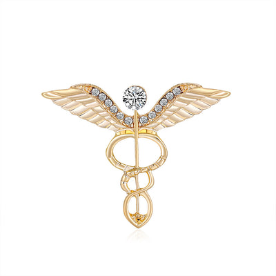 Front product view of the angel wing brooch pin in gold and silver