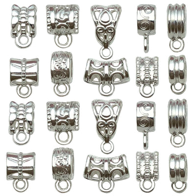 Metallic connector clasp jewelry findings arranged on a light background