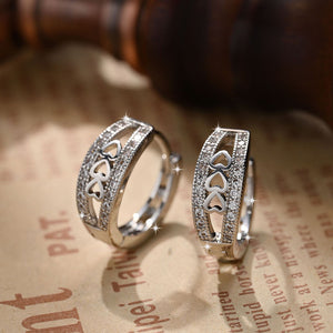 Silver Tone Heart Cutout Hoop Earrings with Clear Stones