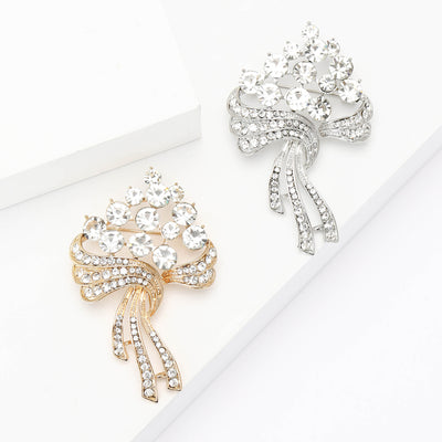 Front view of the crystal flower bouquet brooch with ribbon stems decorative clothing pin on a white background