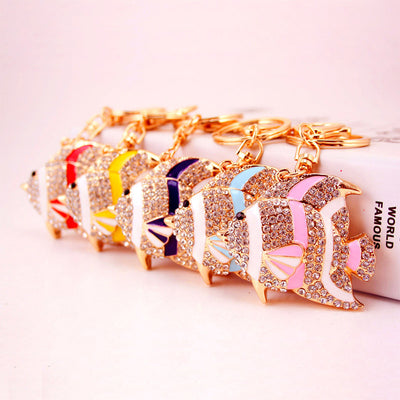 Five jeweled fish keychains in red, yellow, purple, blue, and pink arranged in a row.