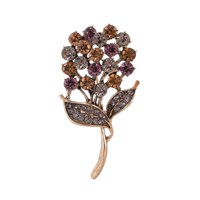 Front product view of an antique flower brooch