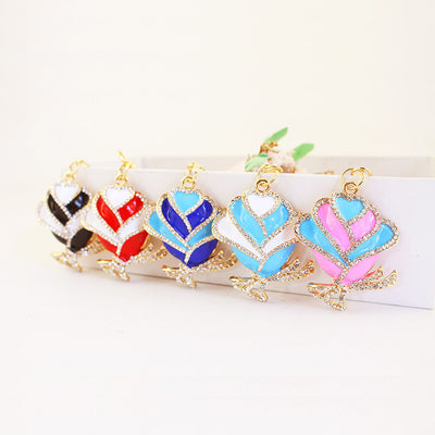 Five rhinestone rose pendants shown in black, red, dark blue, light blue, and pink.