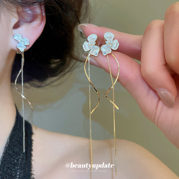 Three Petal Flower Linear Tassel Clip On Earrings With Polished Metal Details