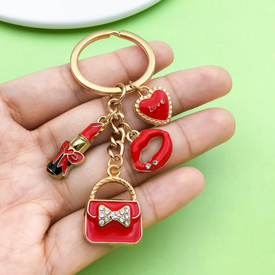 Image 1 showing a person holding a red and gold keychain.