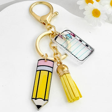 Acrylic Pencil And Notebook Charm Keychain With Yellow Suede Tassel