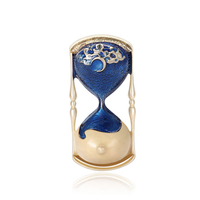 Blue enamel hourglass brooch with gold frame and moon motif front view