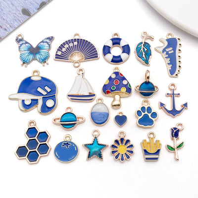 Colorful star and heart charms arranged on a light background