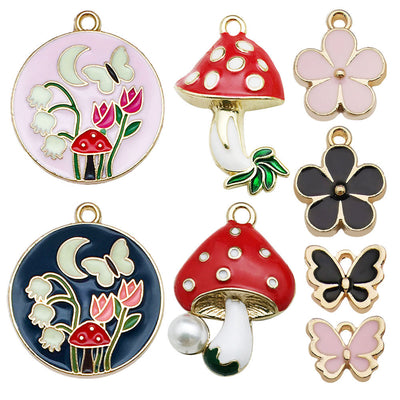 Colorful mushroom and butterfly charms arranged on a light background