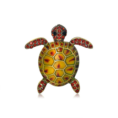 Front product view of the sea turtle brooch pin in gold and yellow