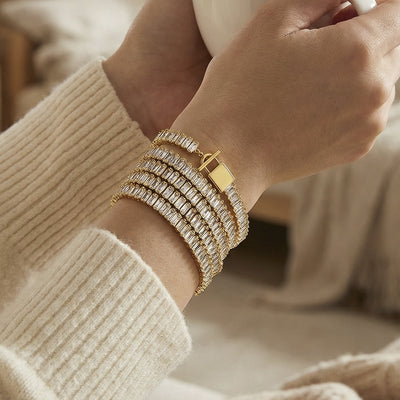 On-wrist view of crystal baguette line toggle bracelets in main image 1.