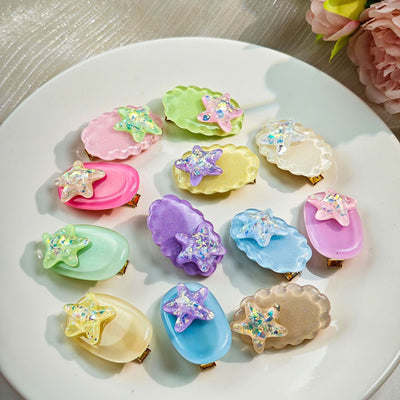 Primary supplied view of colorful bow and star hair clips