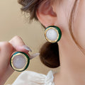 Light Luxury Gold Plated Copper Round Cat Eye Stone Stud Earrings With Silver Posts view 2