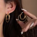 Elegant Luxury Gold Alloy Irregular Hollow Round Multi Ring Layered Hoop Statement Dangle Earrings view 1