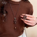 Light Luxury Maillard Wood Sweater Necklace With Enamel Leopard Bow Cross Pendant For Women view 1