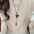 Light Luxury Maillard Wood Sweater Necklace With Enamel Leopard Bow Cross Pendant For Women view 3