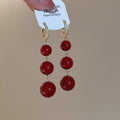 Gold Plated Red Resin Round Bead Tassel Drop Earrings For Women Light Luxury New Year Jewelry view 3