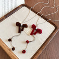 Light Luxury Copper Zircon Flocked Bow Pendant Sweater Necklace For Women view 4