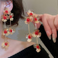 Retro Elegant Iron Hollow Flower Tassel Drop Earrings For Women Light Luxury Statement Design view 3