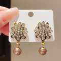 French Vintage Twisted Hollow Round Faux Pearl Stud Earrings With Silver Pins view 3