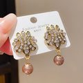 French Vintage Twisted Hollow Round Faux Pearl Stud Earrings With Silver Pins view 2
