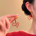 Light Luxury Alloy Red Enamel Fu Character Pony Drop Earrings With Silver Needle Posts view 2
