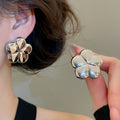 Light Luxury Iron Flower Stud Earrings With Smooth Metal Finish And Rhinestone Accent view 3
