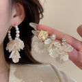 Light Luxury Faux Pearl Flower Stud Earrings With Rhinestone Accents And Silver Posts view 2