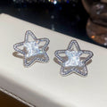 Copper Zircon Hollow Star Stud Earrings Minimalist Light Luxury Fashion Ear Jewelry view 4