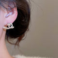 Minimalist Metal Cross Twist Triangle Stud Earrings Modern Geometric Light Luxury Ear Jewelry view 3