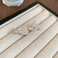Minimalist Metal Cross Twist Triangle Stud Earrings Modern Geometric Light Luxury Ear Jewelry view 2