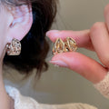 Light Luxury Vintage Copper Teardrop Earrings With Rhinestone Hollow Oval Design view 1