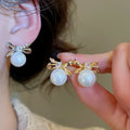 French Light Luxury Bow Faux Pearl Zircon Geometric Stud Earrings for Women view 2