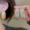 European American Style Oval Pleated Striped Metal Stud Earrings For Women view 1