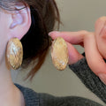 European American Style Oval Pleated Striped Metal Stud Earrings For Women view 3