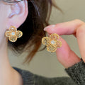 Gold Plated Copper Zircon Hollow Flower Stud Earrings Light Luxury Minimalist Floral Jewelry view 4