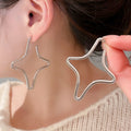 Alloy Hollow Cross Stud Earrings Minimalist Geometric Light Luxury Niche Design view 3