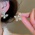 18K Gold Plated Zircon Hollow Butterfly Faux Pearl Stud Earrings For Women Light Luxury view 1