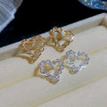 18K Gold Plated Copper Hollow Heart Zircon Stud Earrings With Silver Posts For Women view 3