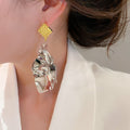 Alloy Irregular Leaf Pendant Drop Earrings Geometric Niche Style Metal Stud Earrings view 3