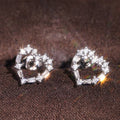 Sweet Hollow Heart Stud Earrings For Women With Sparkling Geometric Zircon Inlay view 2