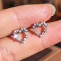 Sweet Hollow Heart Stud Earrings For Women With Sparkling Geometric Zircon Inlay view 3