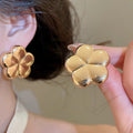 Polished Iron Flower Stud Earrings For Women, Minimalist Modern Light Luxury Jewelry view 4