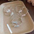 Copper Bow Hoop Earrings With Zircon Accents And Enamel Detail Playful Light Luxury Style view 2