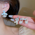 Elegant Floral Faux Pearl Stud Earrings With Enamel Petals Modern Minimalist Luxury Style view 2