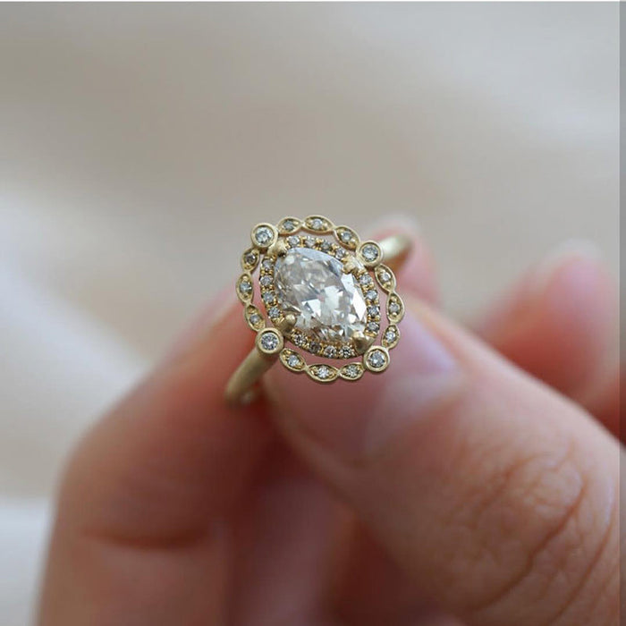 Gold Tone Oval Cluster Halo Ring In A Polished Decorative Design